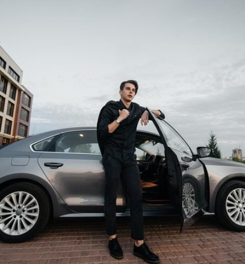 stylish-businessman-smokes-cigars-near-luxury-car-fashion-business_180601-765